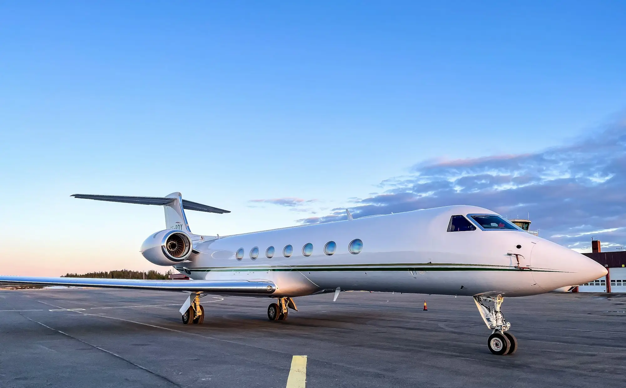 A long-range jet waiting on the apron at dusk