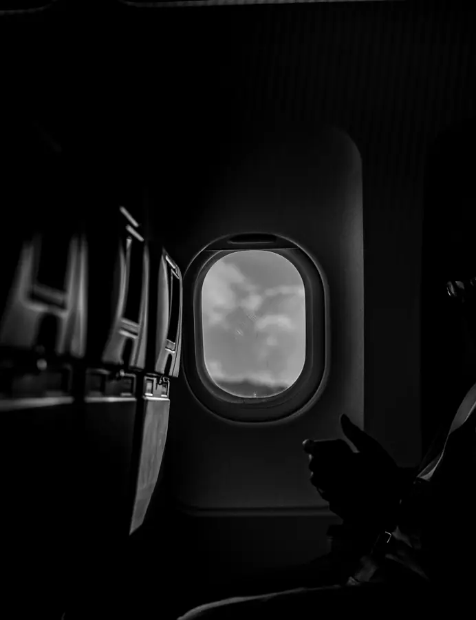 Black and white view through a jet cabin window